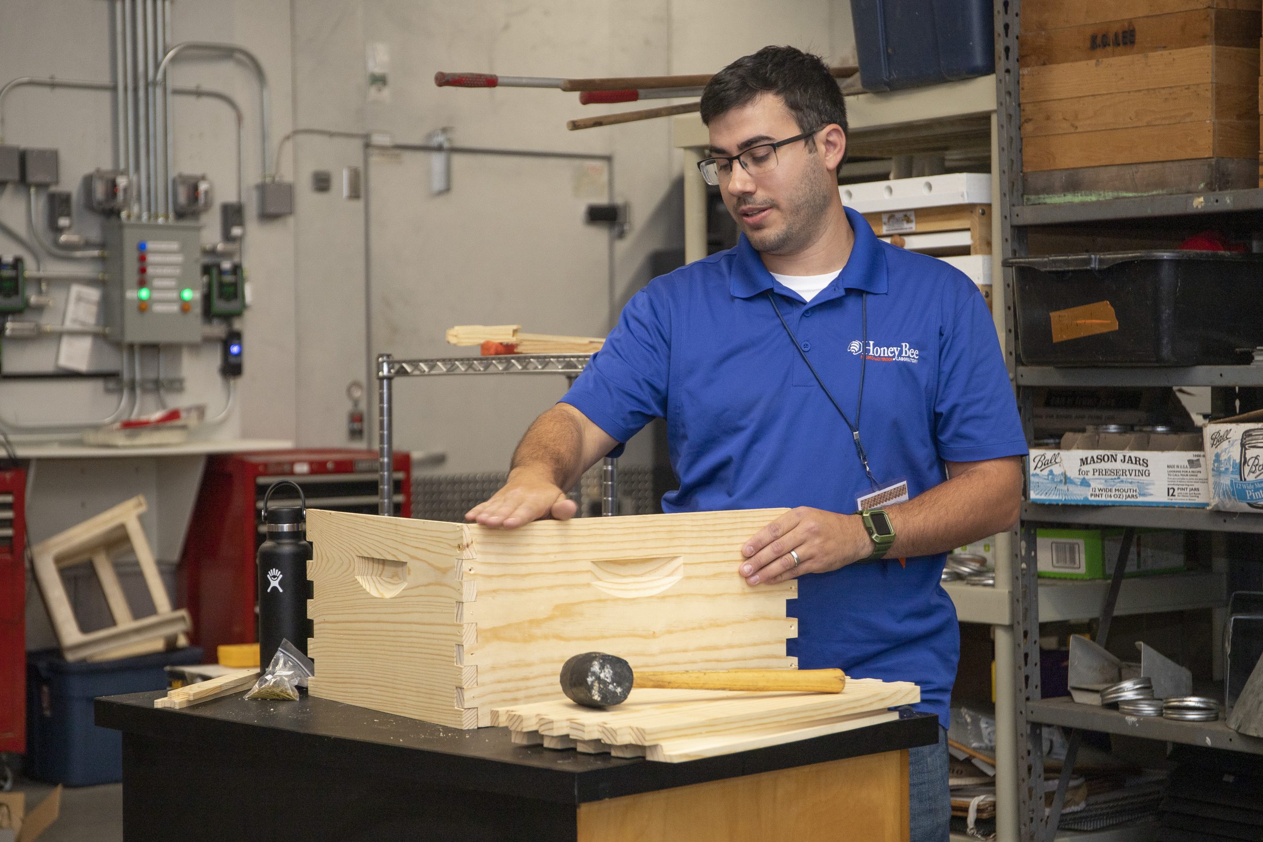 Figure 7. The UF/IFAS HBREL beekeeper, Steven Keith, assembling a hive box. 
Photo credit: Cat Wofford, UF/IFAS Communications