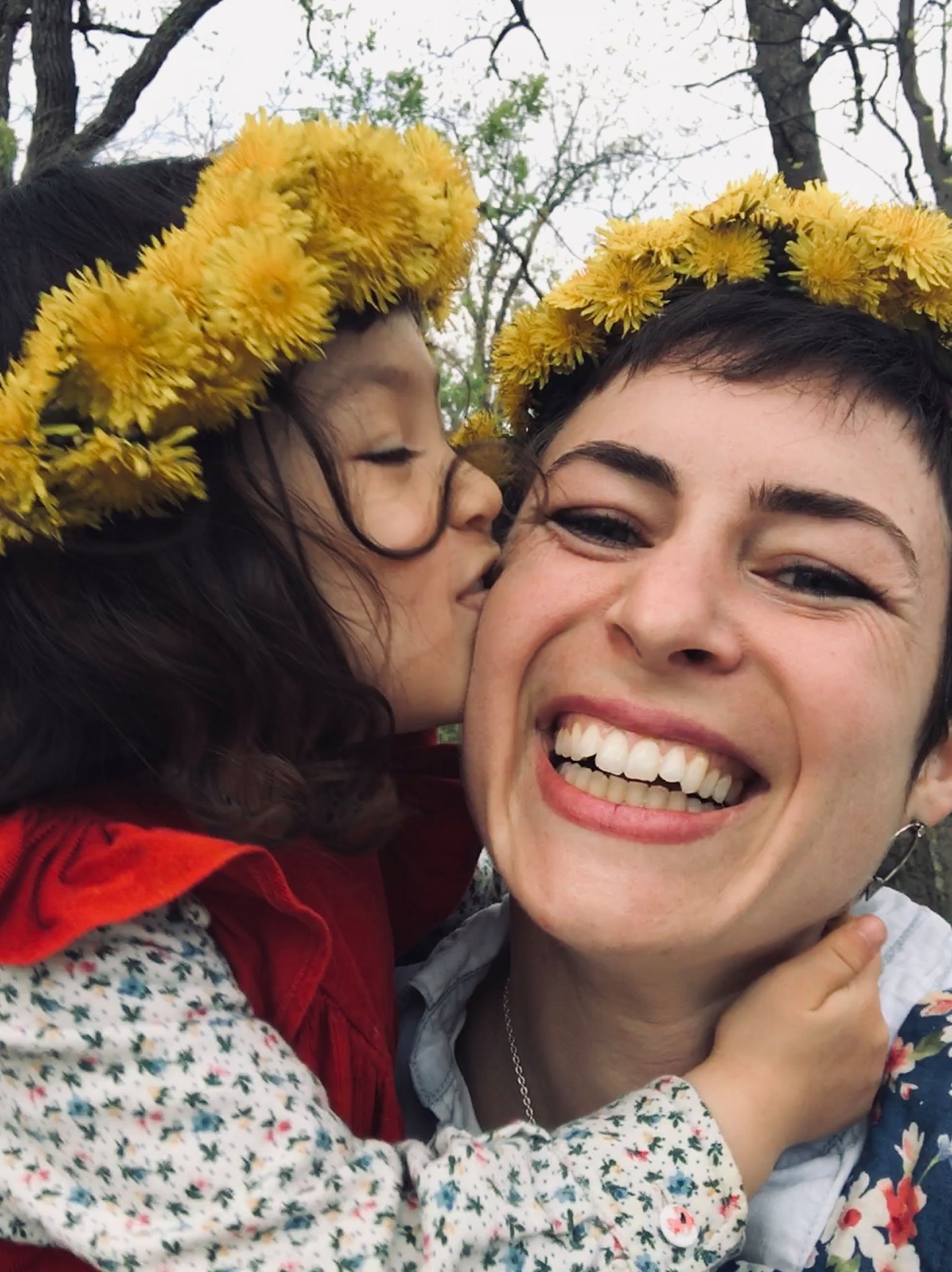 Dandelions provide more than the first major nectar of the Minnesota honey bee season. Here they are celebrated by Bridget Mendel and her daughter. Photo credit: Bridget Mendel.