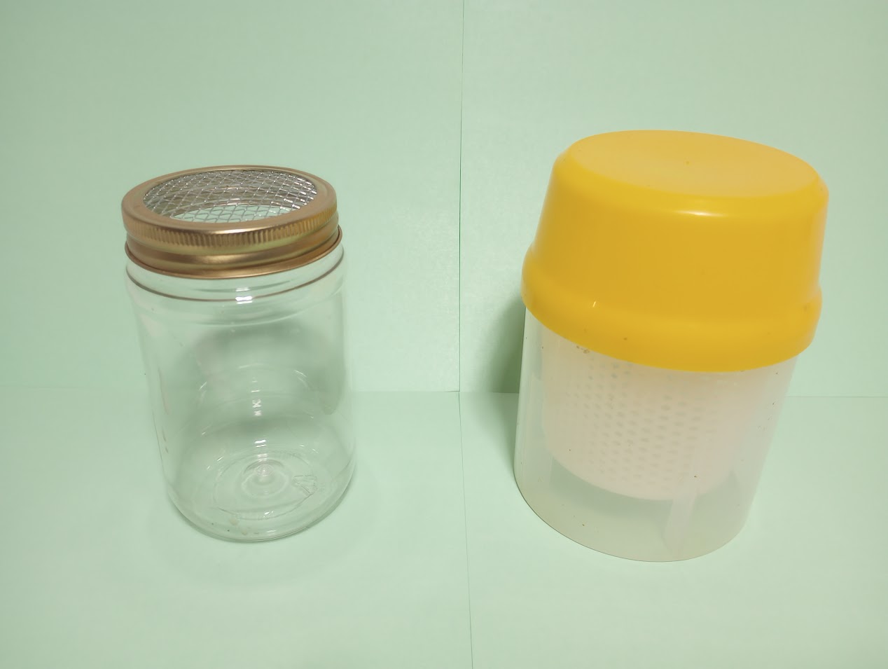 Pint jar for powdered sugar roll with screen mesh on the left with commercial alcohol wash container on the right. Photo Credit: Richard Wahl.