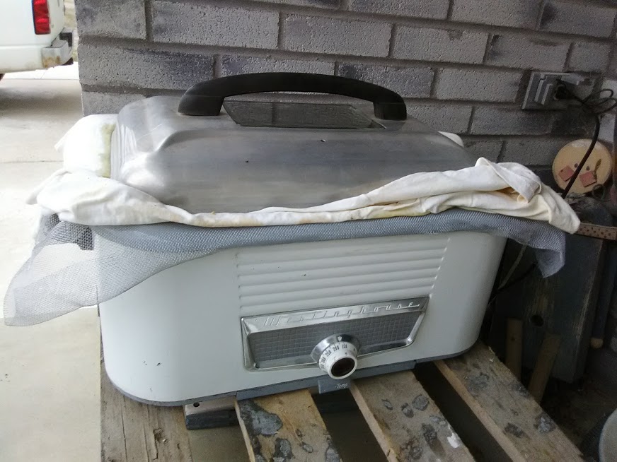 A used turkey roaster with window screen and a t-shirt is used for final rendering(s) of wax. Photo credit: Richard Wahl